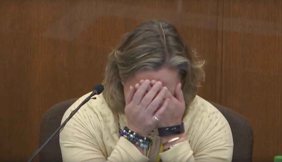In this screen grab from video, former Brooklyn Center Police Officer Kim Potter becomes emotional as she testifies in court, Friday, Dec. 17, 2021 at the Hennepin County Courthouse in Minneapolis, Minn. Potter is charged with first and second-degree manslaughter in the April 11 shooting of Daunte Wright, a 20-year-old Black motorist, following a traffic stop in the Minneapolis suburb of Brooklyn Center. (Court TV, via AP, Pool)