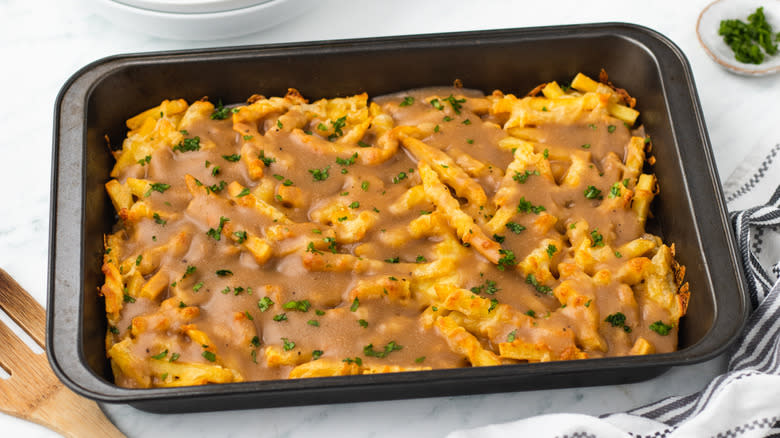 Disco fries with gravy in baking dish