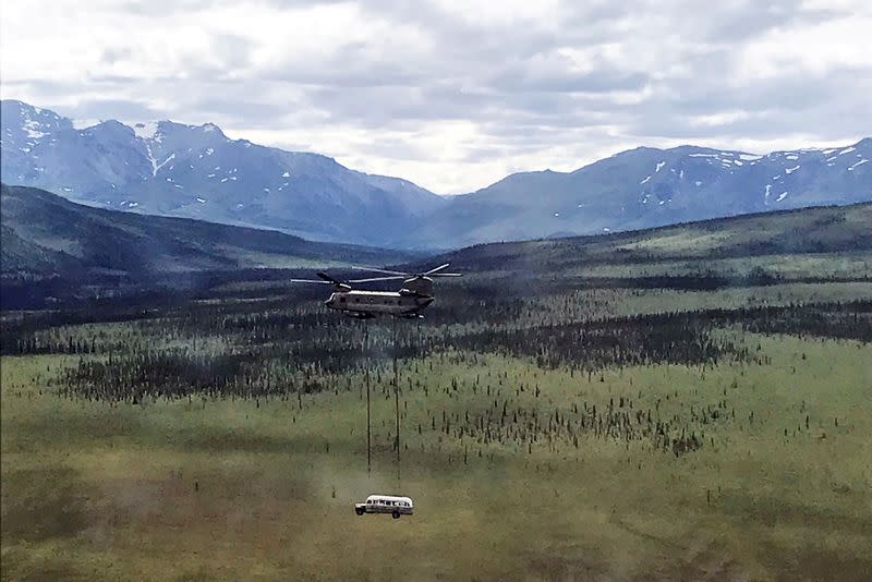 laska Army National Guard CH-47 Chinook helicopter carries the bus made famous by the &#39;Into the Wild&#39; book and movie near Stampede Trail