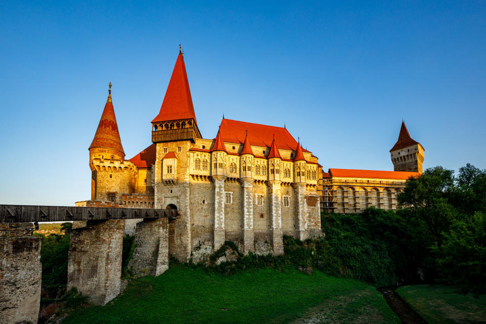 A castle with red spires on a hill