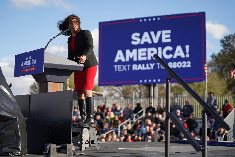 House of Representatives candidate Katie Arrington stands on a step stool while speaking to a crowd during a rally with former U.S. President Donald Trump at the Florence Regional Airport on March 12, 2022 in Florence, South Carolina. The visit by Trump was his first rally in South Carolina since his election loss in 2020.