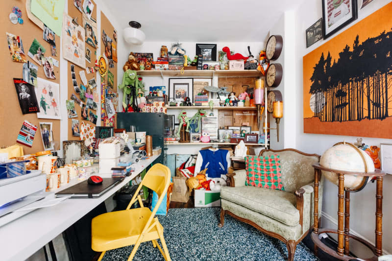 White and corkboard maximalist office.