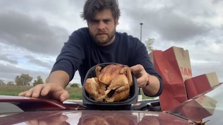 Alexander Tominsky eating chicken