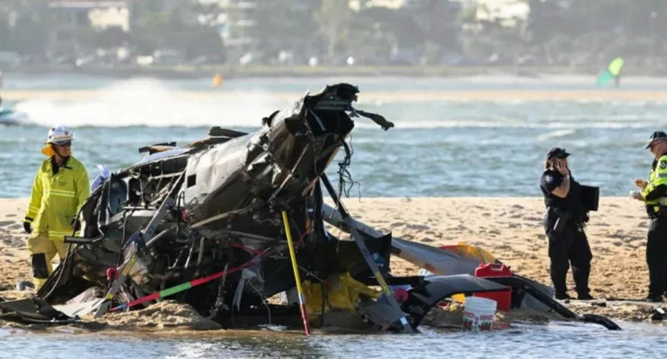 A photo of remnants of the helicopter that Nicholas and Vanessa Tadros were riding in were scattered across Gold Coast beach.