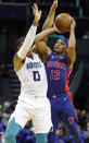 Charlotte Hornets' Miles Bridges (0) tries to block Detroit Pistons' Tim Frazier's shot during the second half of an NBA preseason basketball game in Charlotte, N.C., Wednesday, Oct. 16, 2019. The Pistons won 116-110. (AP Photo/Bob Leverone)