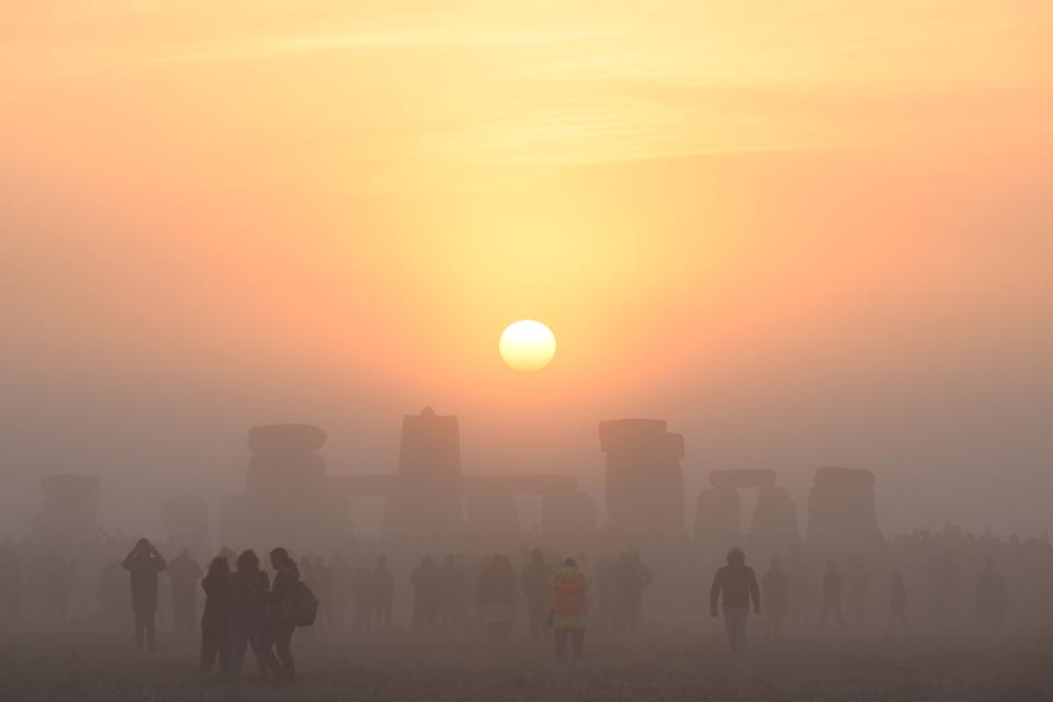 June 21, 2022: Revelers celebrate the Summer Solstice as the sun rises at Stonehenge, near Amesbury, in Wiltshire, southern England in a festival, which dates back thousands of years, celebrating the longest day of the year when the sun is at its maximum elevation.