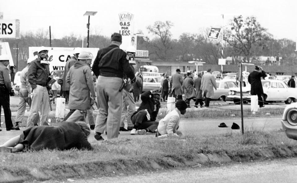 Civil rights demonstrators struggle on the ground as state troopers use violence to break up a march in Selma, Ala., on what is known as Bloody Sunday on March 7, 1965. (AP Photo)