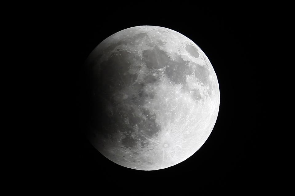 A shadow falls on the moon as it undergoes a total lunar eclipse as seen from Mexico City April 15, 2014. (REUTERS/Edgard Garrido)