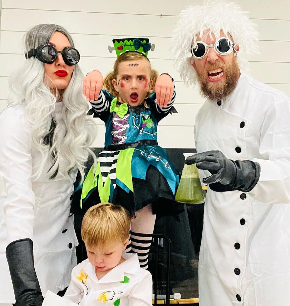 Brie Bella and Husband Bryan are Mad Scientists with Buddy — with Daughter Birdie as the Monster