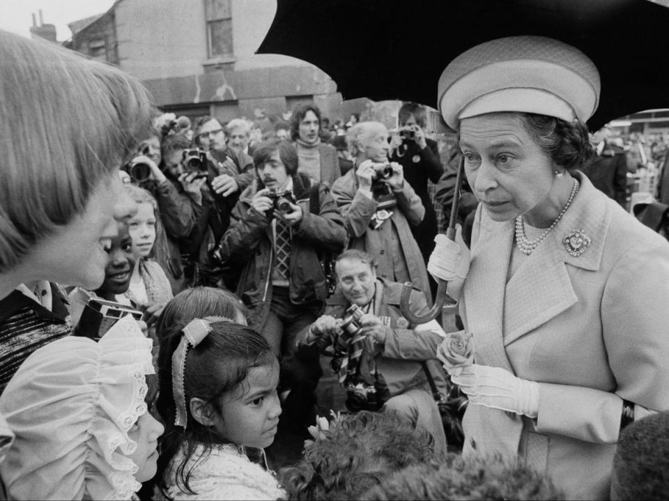 Queen Elizabeth II talking to children in Deptford, during a walkabout to commemorate her Silver Jubilee (Getty Images)