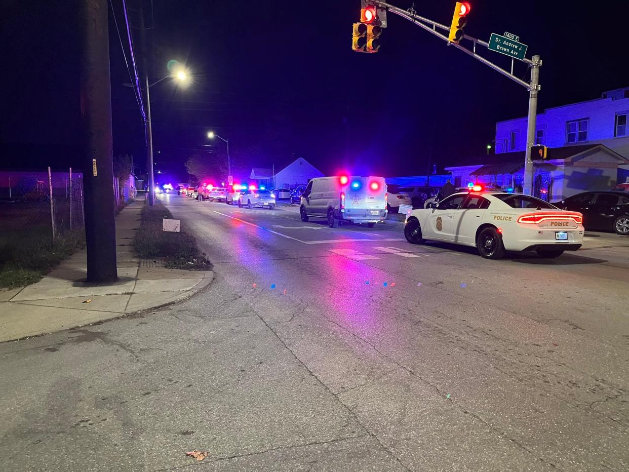 Indianapolis police have Dr. Andrew J. Brown Boulevard and East 25th Street blocked as they investigate a shooting involving one of their officers early Tuesday, Oct. 24, 2023.