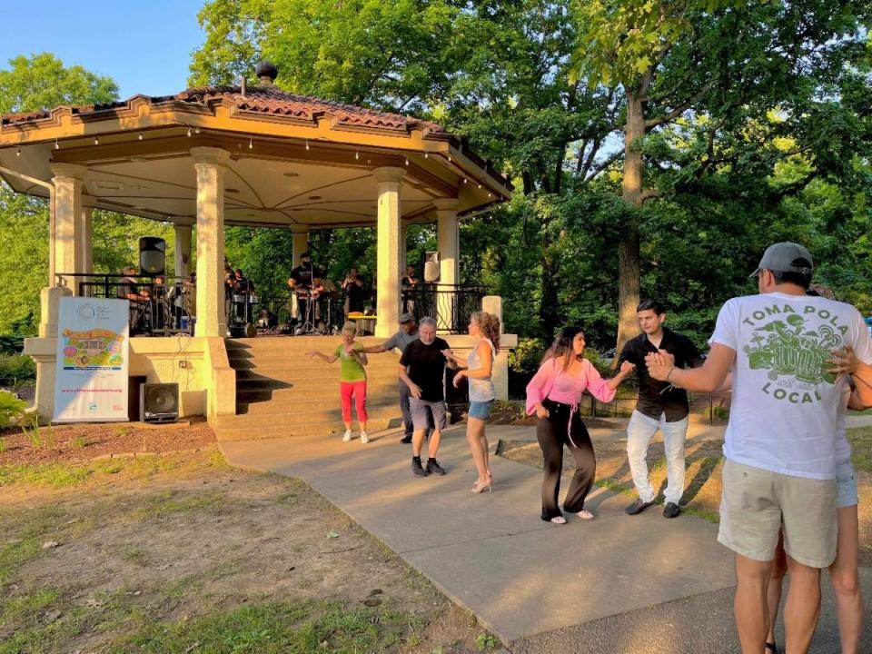 Couples dance during Wednesdays in the Woods at Burnet Woods Bandstand.