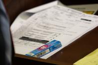 A pack of Bubblicious gum rests upon an Enterprise rental agreement on the lectern during the murder trial for former New England Patriots player Aaron Hernandez at the Bristol County Superior Court in Fall River, Massachusetts, February 18, 2015. REUTERS/Dominick Reuter/Pool (UNITED STATES - Tags: CRIME LAW SPORT FOOTBALL)