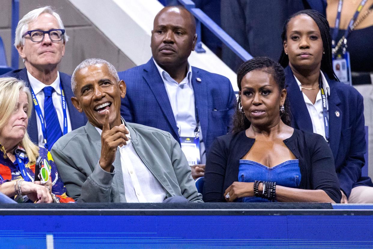 Former US President Barack Obama (L) and his wife former US First Lady Michelle Obama attend the US Open tennis tournament men's singles first round match between Serbia's Novak Djokovic and France's Alexandre Muller at the USTA Billie Jean King National Tennis Center in New York City, on August 28, 2023. (Photo by COREY SIPKIN / AFP) (Photo by COREY SIPKIN/AFP via Getty Images)