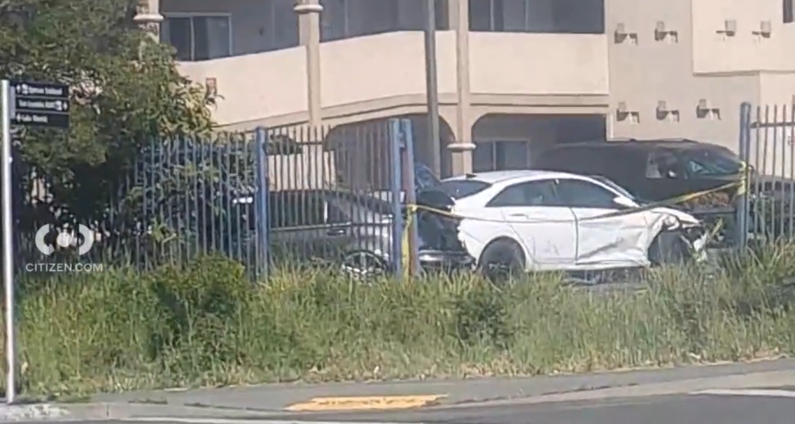 A car crashed into the parking lot of Americas Best Value Inn on Sunday, May 5 in Oakland (Citizen App).