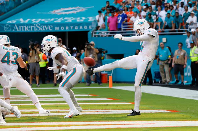 Miami Dolphins punter Thomas Morstead (4) punts the ball off the backside of Miami Dolphins wide receiver Trent Sherfield (14) for a safety during the game between the Buffalo Bills and the Miami Dolphins on Sunday at Hard Rock Stadium in Miami Gardens, Florida. (Photo: David Rosenblum/Icon Sportswire via Getty Images)