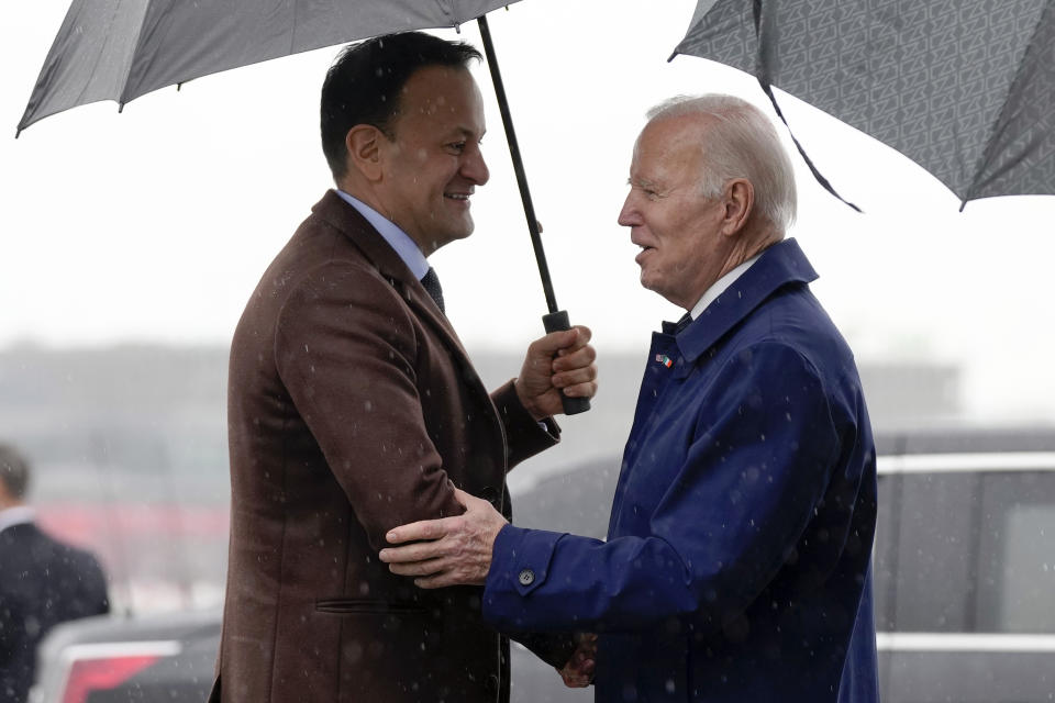 President Joe Biden shakes hands with Ireland's Taoiseach Leo Varadkar as he arrives at Dublin International Airport in Dublin, Ireland, Wednesday, April 12, 2023. (AP Photo/Patrick Semansky)