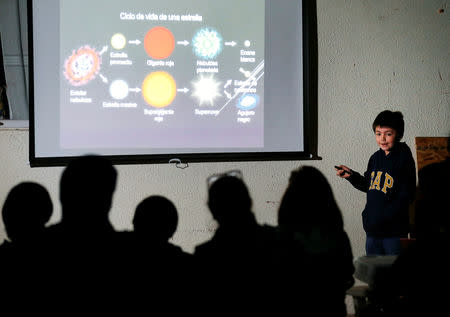 FILE PHOTO: Ricardo Barriga, 10, speaks and teaches astronomy to adults and younger in hopes of raising money for his own astronaut suit, in Pirque, Chile January 16, 2019. REUTERS/Rodrigo Garrido