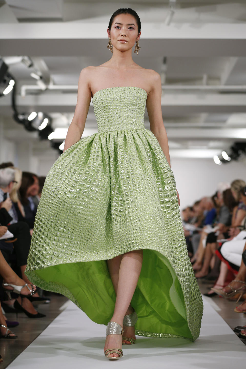 The Oscar de la Renta Spring 2014 collection is modeled during Fashion Week in New York, Tuesday, Sept. 10, 2013. (AP Photo/John Minchillo)