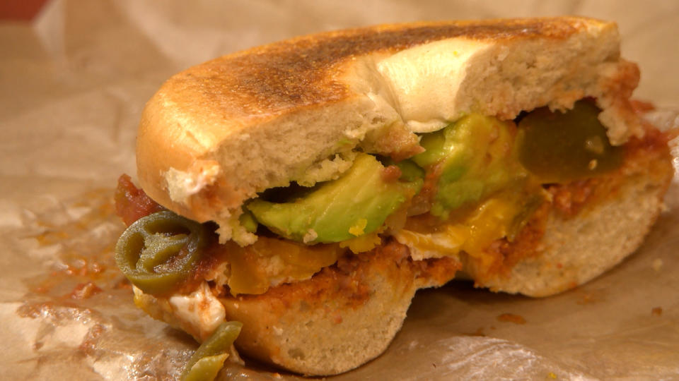 One of the featured bagels on the menu can be seen here spilt in half.