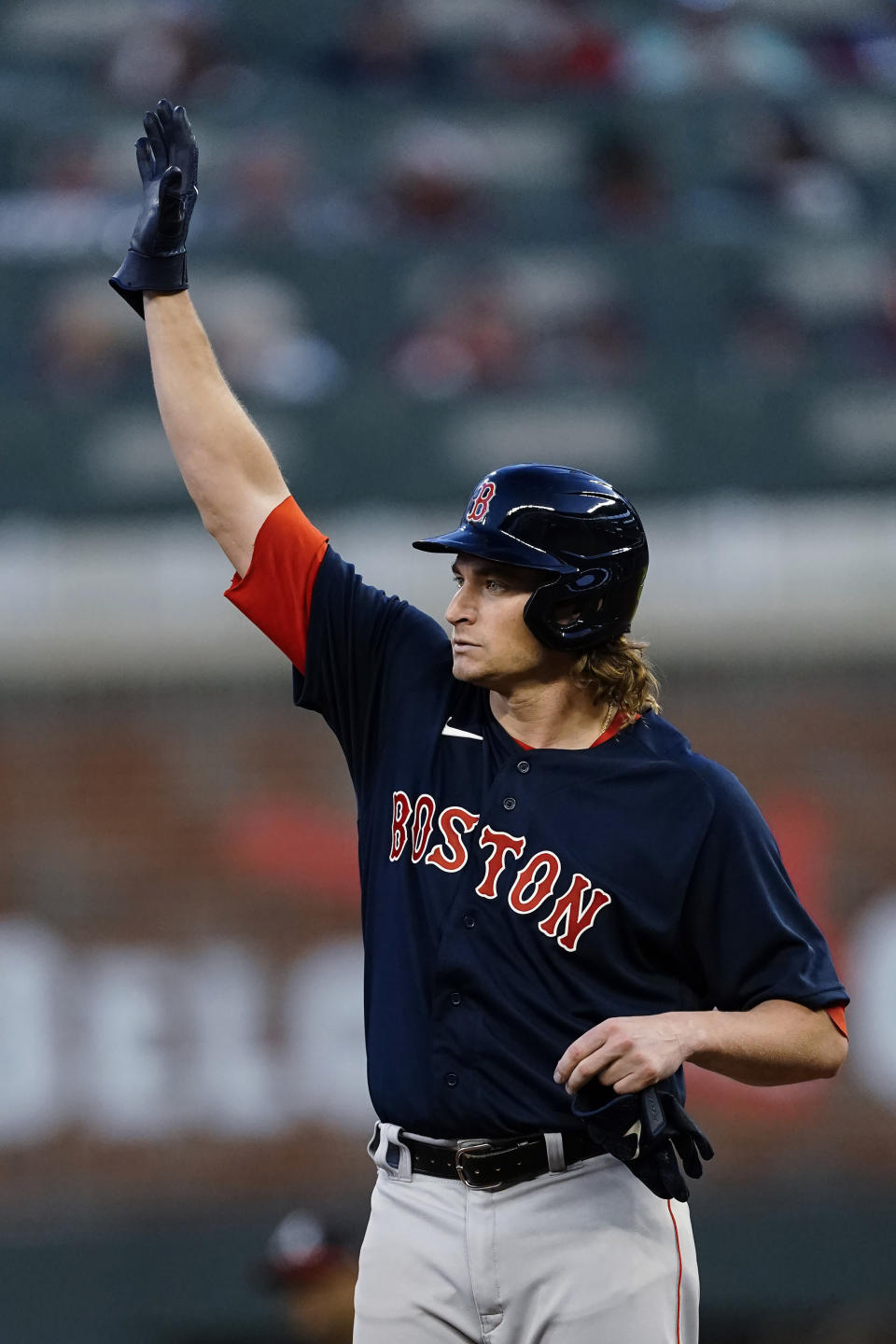 Boston Red Sox pitcher Garrett Richards waves to the crowd from second base after driving in a run with a double during the fourth inning of the team's baseball game against the Atlanta Braves Wednesday, June 16, 2021, in Atlanta. (AP Photo/John Bazemore)