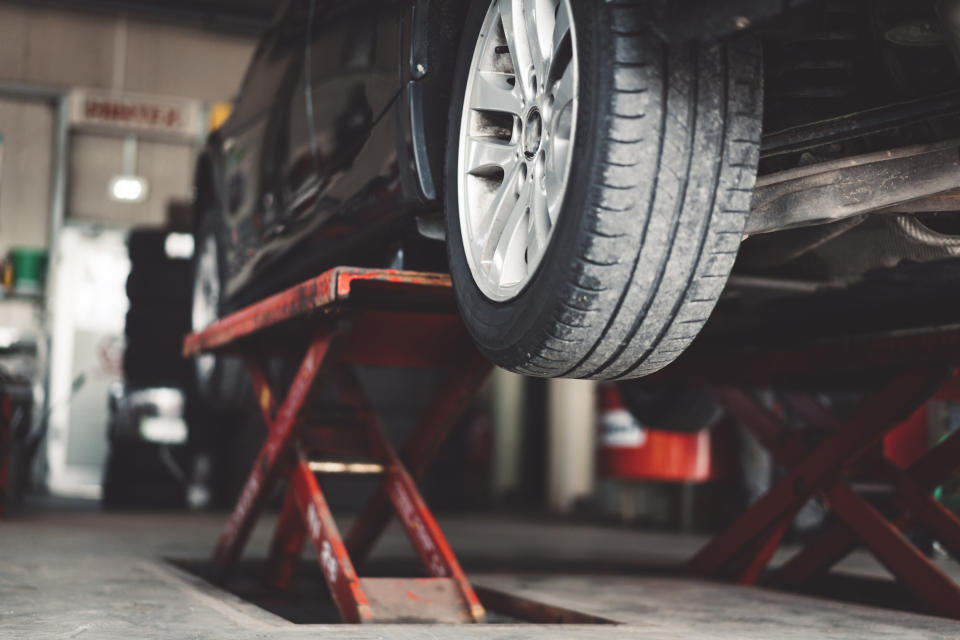 car lifted at auto body