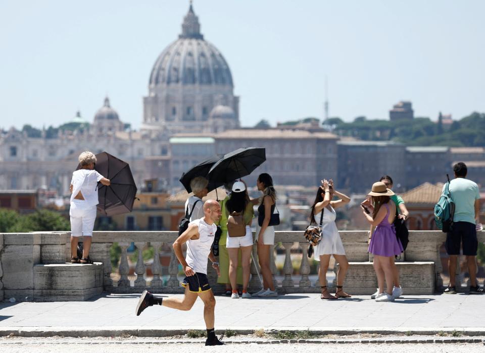 A man jogs at the Pincio terrace during a heatwave across Italy (REUTERS)