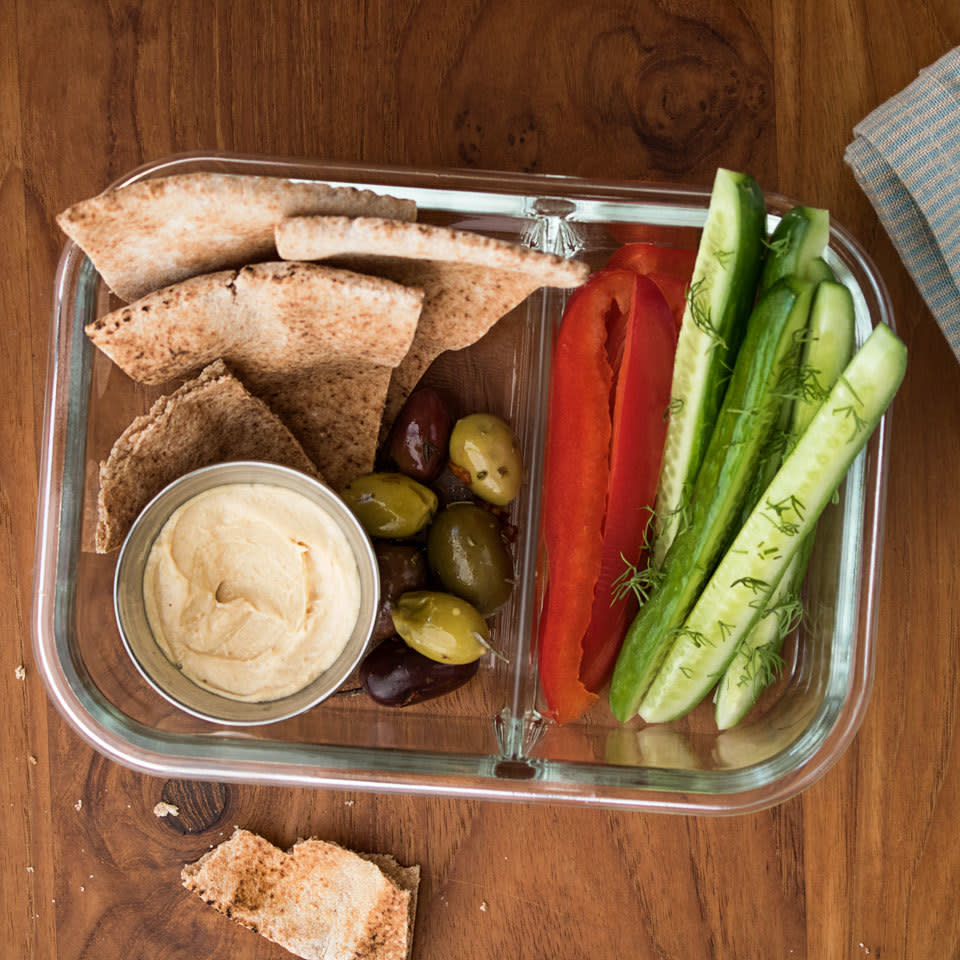 <p>Perfect to pack for lunch to take to work or for a picnic in the park, this vegan bistro box is filled with Mediterranean diet-inspired crunchy vegetables, pita bread, creamy hummus and olives. <a href="https://www.eatingwell.com/recipe/264674/vegan-bistro-lunch-box/" rel="nofollow noopener" target="_blank" data-ylk="slk:View Recipe" class="link ">View Recipe</a></p>
