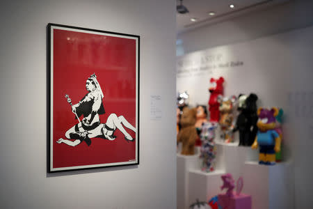 An offset lithograph entitled "Queen Vic" (2004) by artist Banksy is displayed during a press preview ahead of the upcoming auction "Search & Stop" organized by Artcurial in Paris, France, October 18, 2018. REUTERS/Benoit Tessier
