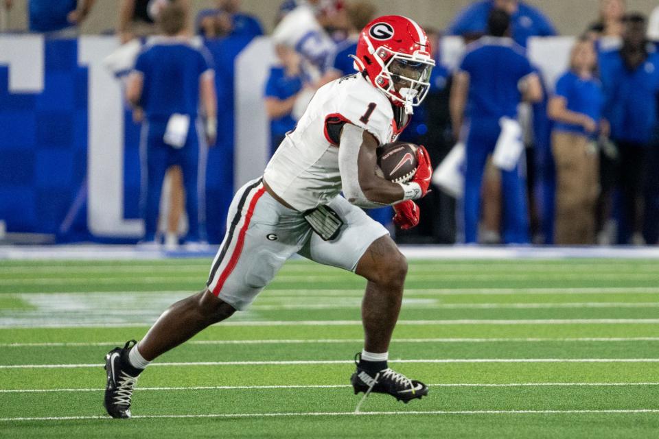 Sep 14, 2024; Lexington, Kentucky, USA; Georgia Bulldogs running back Trevor Etienne (1) runs the ball down the field during the third quarter against the Kentucky Wildcats defense at Kroger Field. Mandatory Credit: Tanner Pearson-Imagn Images