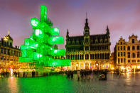 An abstract light installation replaces the traditional Christmas tree at the Grand Place in Brussels, Saturday Dec. 1, 2012. Traditionally, a 20m (65ft) pine tree from the forests of the Ardennes decorates the city's central square, the Grand Place. This year, it has been replaced with a 25m (82ft) construction. (AP Photo/Geert Vanden Wijngaert)