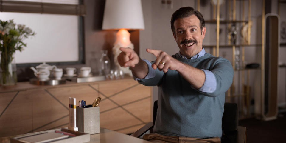 This image released by Apple TV Plus shows Jason Sudeikis in "Ted Lasso." Sudeikis accepted the award for best actor in a television series, musical or comedy at the Golden Globe Awards on Sunday, Feb. 28, 2021. (Apple TV Plus via AP)