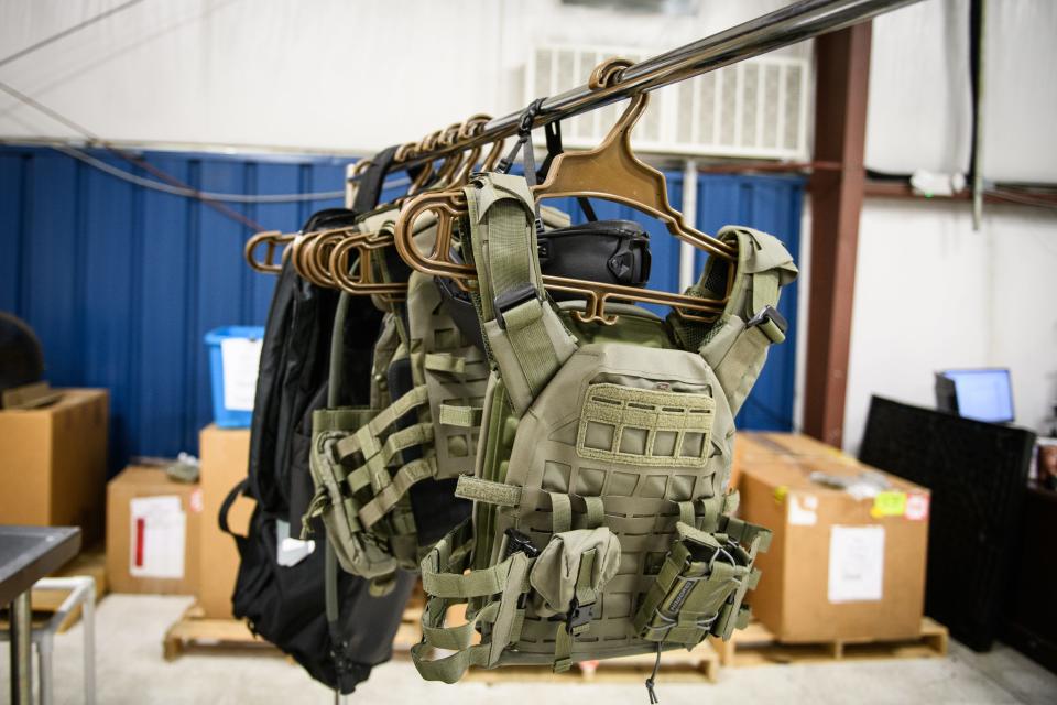 A Hagor Industries plate carrier — a vest that holds body armor — and other Hagor products hang from a rack at the Wahconah Tactical Services Division on McMillan Street. Hagor equipment like this will soon be manufactured by Wahconah in Fayetteville for sale to the U.S. military.