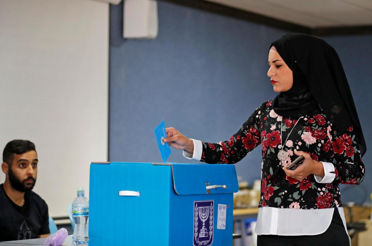 An Arab Israeli woman votes during Israel's parliamentary election at a polling station in Kafr Manda near Haifa on September 17, 2019: AHMAD GHARABLI/AFP/Getty Images