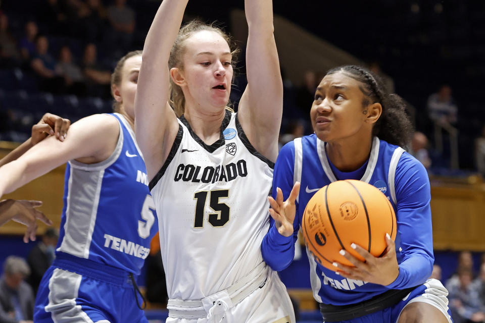 Middle Tennessee State's Courtney Blakely, left, drives the ball around Colorado's Kindyll Wetta (15) during the first half of a first-round college basketball game in the NCAA Tournament, Saturday, March 18, 2023, in Durham, N.C. (AP Photo/Karl B. DeBlaker)