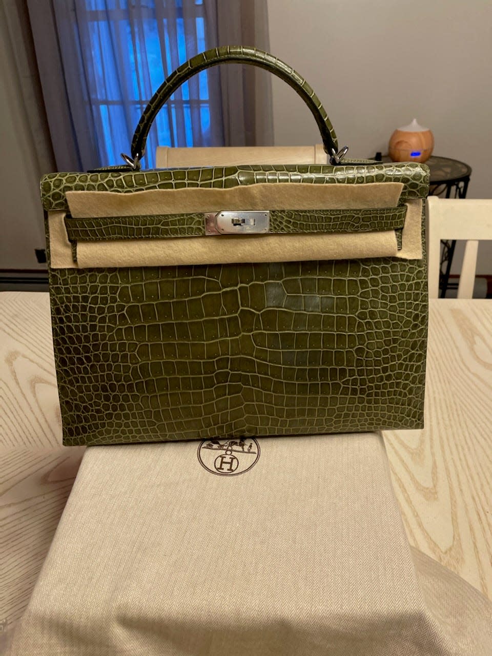 A 40 -centimeter Green Crocodile Skin Kelly bag that was taken from Only Authentics luxury boutique during a grab and smash December 14.