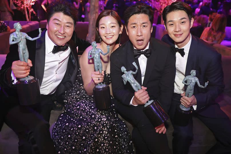 From left: Song Kang-ho, Park So-dam, Lee Sun-kyun, and Choi Woo-shik, winners of the award for outstanding performance by a cast in a motion picture for "Parasite" - 2020