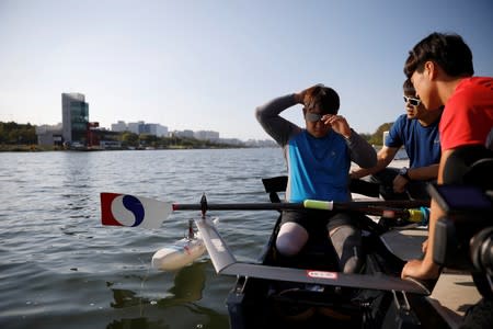 Former South Korean Army sergeant Ha Jae-hun, who lost both his legs in 2015 when he stepped on a North Korean landmine while on patrol in the DMZ, prepares for a practice session at Misari Rowing Stadium in Hanam, South Korea