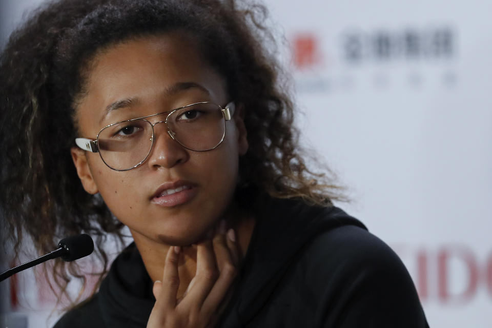 FILE - In this Oct. 29, 2019, file photo, Naomi Osaka of Japan speaks during a press conference at the WTA Finals Tennis Tournament in Shenzhen, China's Guangdong province. Naomi Osaka will play in the Western & Southern Open semifinals, after all. A day after saying she would withdraw from the hard-court event to protest “the continued genocide of Black people at the hand of the police" — prompting the tournament to call off all of Thursday's matches — the two-time Grand Slam champion and former No. 1-ranked player changed course. Her agent confirmed that Osaka will face No. 14 Elise Mertens when play resumes at the tournament Friday with the semifinals. (AP Photo/Andy Wong, File)