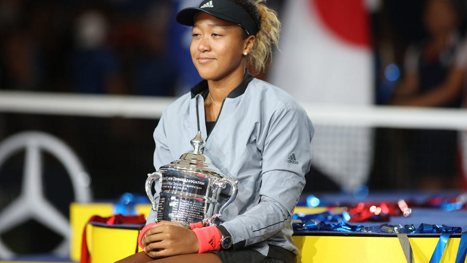 Naomi Osaka with the winners trophy. (Photo by Tim Clayton/Corbis via Getty Images)