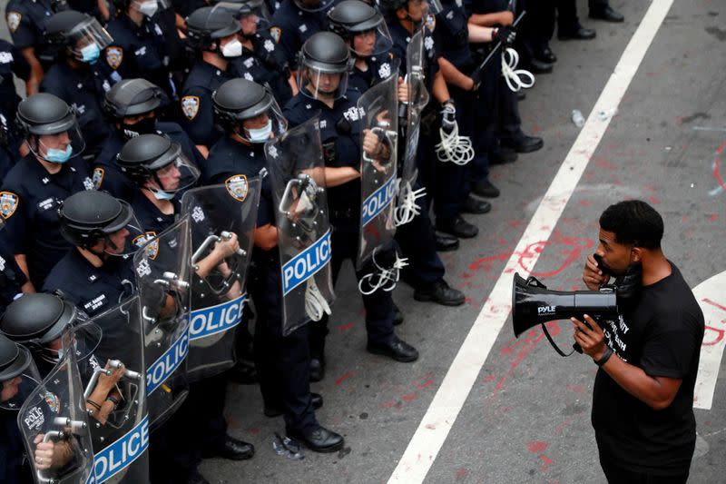 FILE PHOTO: The City Hall Autonomous Zone protest to defund the New York Police Department (NYPD) in Manhattan, New York City