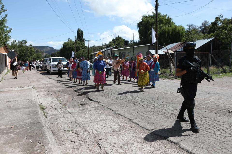 <div class="inline-image__caption"><p>A police officer stands by during the funeral procession for the two for Jesuit priests Javier Campo Morales and Joaquin Mora.</p></div> <div class="inline-image__credit">HERIKA MARTINEZ/AFP via Getty Images</div>