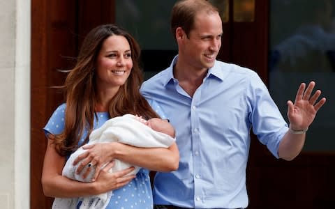 Prince William and Kate, Duchess of Cambridge, hold their new born son George - Credit:  Lefteris Pitarakis