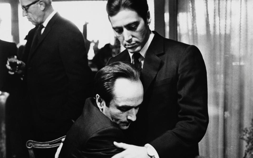 Fredo Corleone, played by John Cazale, holds his brother Michael Corleone, played by Al Pacino, in The Godfather: Part II - Credit: Corbis via Getty Images