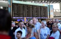 People gather at Frankfurt airport terminal after Terminal 1 departure hall was evacuated in Frankfurt, Germany, August 31, 2016. REUTERS/Alex Kraus