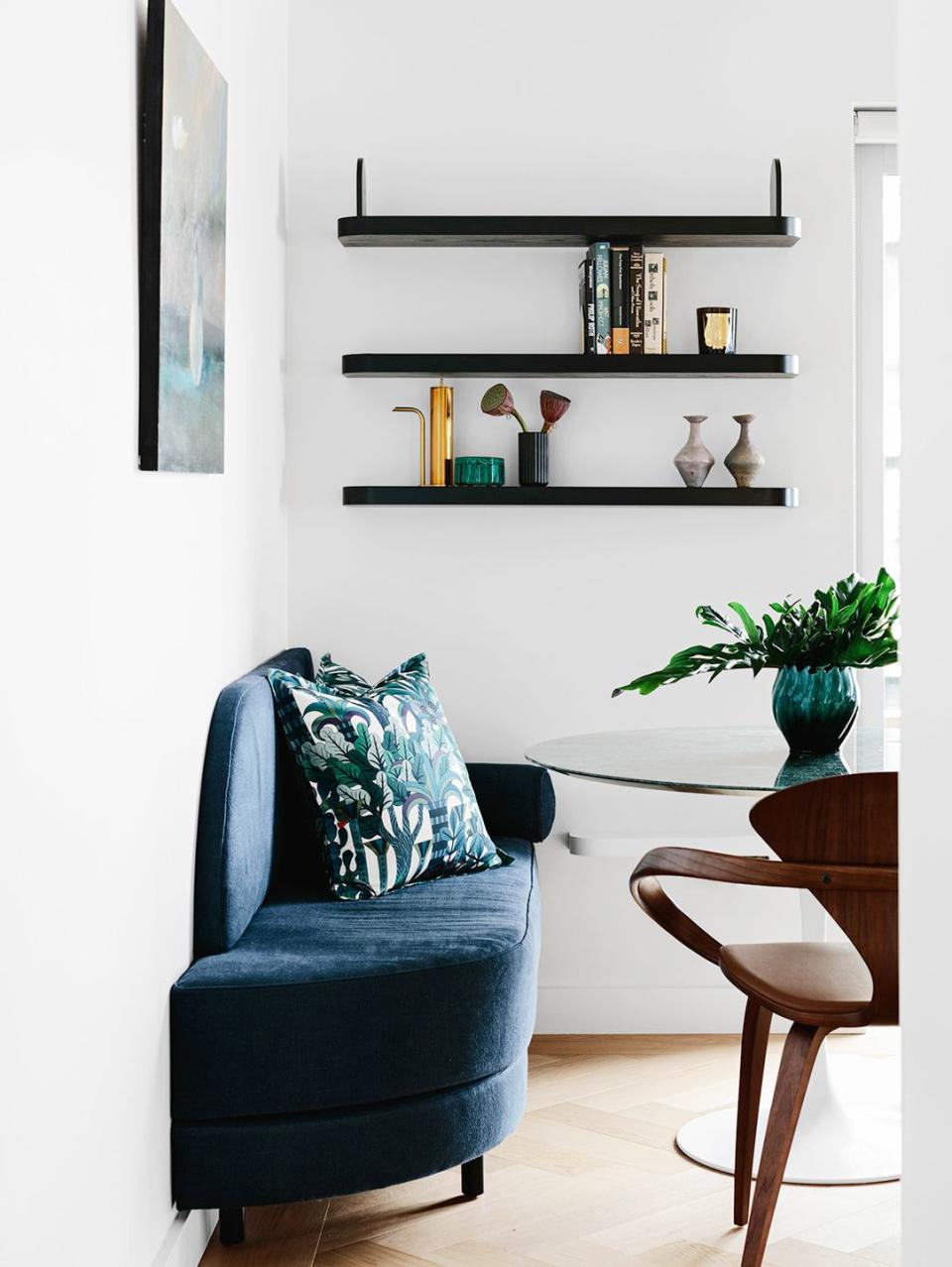 <p>In smaller spaces, where a tulip table is all you can squeeze in, choose fun accent chairs and consider a built-in bench. A casual gallery wall or statement-making floating shelves displaying decor will spice things up without taking up any precious square footage. This breakfast nook designed by<a href="https://arentpyke.com/" rel="nofollow noopener" target="_blank" data-ylk="slk:Arent & Pyke;elm:context_link;itc:0;sec:content-canvas" class="link "> Arent & Pyke</a> proves it.</p>