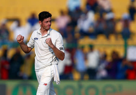 Cricket - India v New Zealand - First Test cricket match - Green Park Stadium, Kanpur, India - 22/09/2016. New Zealand's Mitchell Santner celebrates after taking the wicket of India's Rohit Sharma. REUTERS/Danish Siddiqui