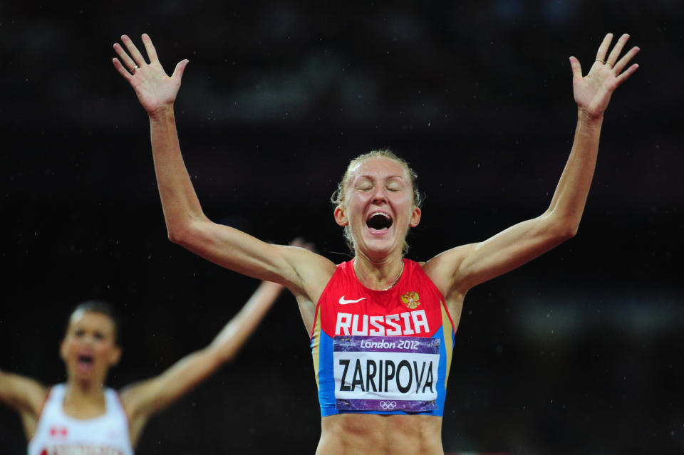 LONDON, ENGLAND - AUGUST 06: Yuliya Zaripova of Russia celebrates as she crosses the finish line to win the gold medal in the Women's 3000m Steeplechase final on Day 10 of the London 2012 Olympic Games at the Olympic Stadium on August 6, 2012 in London, England. (Photo by Stu Forster/Getty Images)