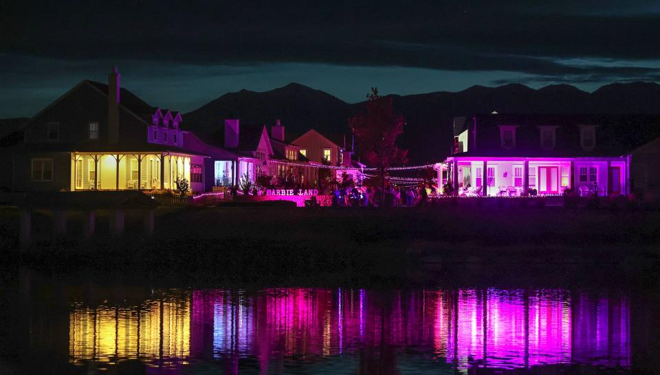 People walk through a Daybreak neighborhood that is decorated in a Barbie theme for Halloween in South Jordan on Friday, Oct. 13, 2023. | Kristin Murphy, Deseret News