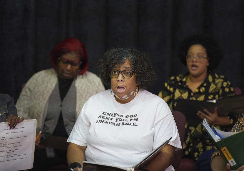 Michelle Middleton, center, rehearses with fellow members of The Heritage Gospel Chorale of Pittsburgh, a multi-ethnic and multi-generational choral ensemble specializing in the performance of African American sacred music, gospel music and spirituals, at Bethany Baptist Church in Pittsburgh, on Monday, March 6, 2023. The choir will be one of two performers at an upcoming concert honoring the late gospel composer, musician and publisher, Charles Henry Pace, who's being newly recognized as of the early pioneers of African American gospel composition and publishing. (AP Photo/Jessie Wardarski)